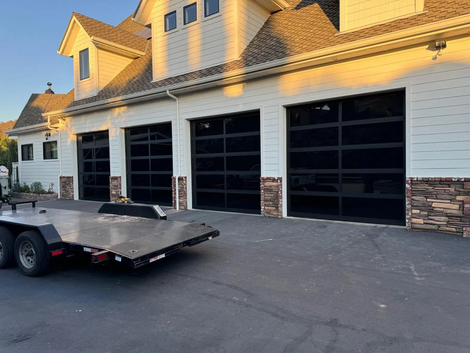 Professional garage door repair technician working on residential garage door