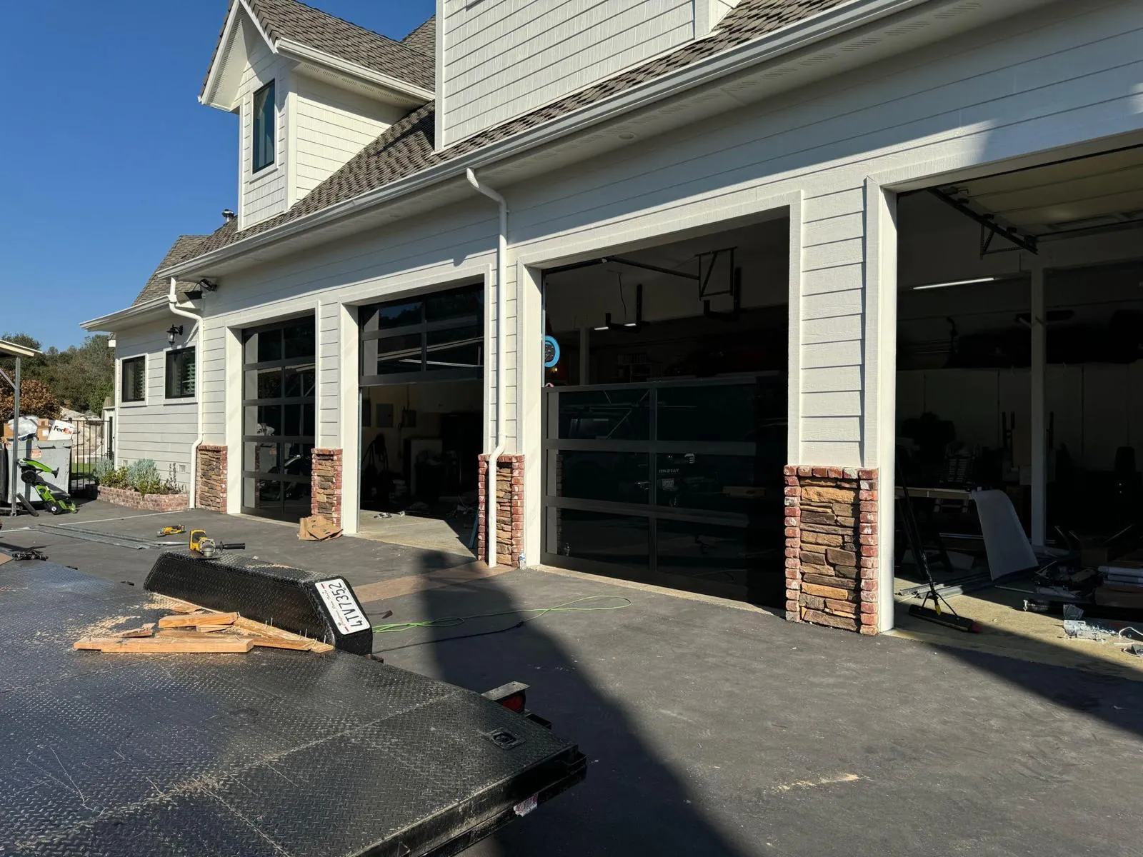 Professional garage door repair technician working on residential garage door